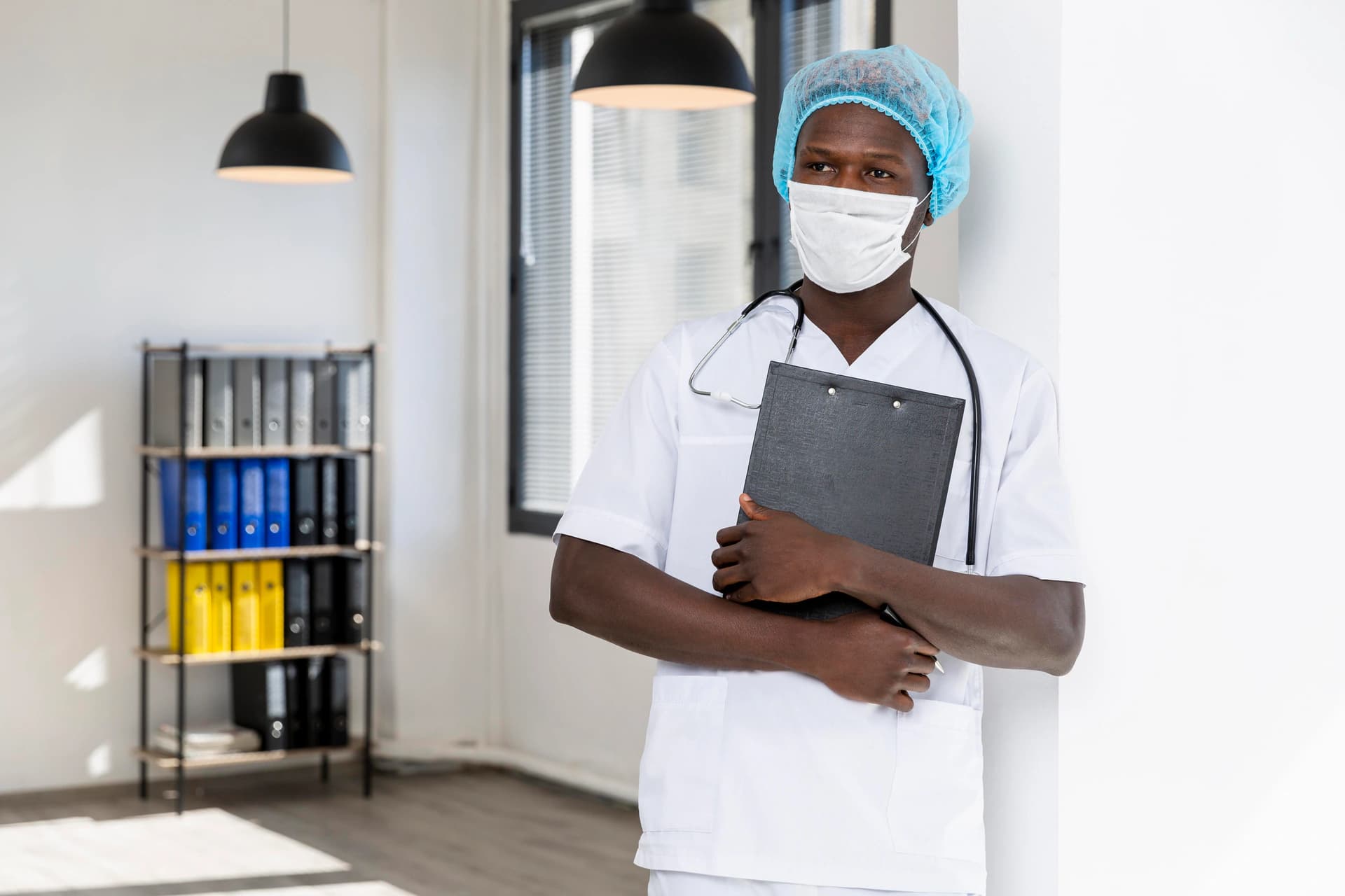 Healthcare professional holding a clipboard in a clinical office
