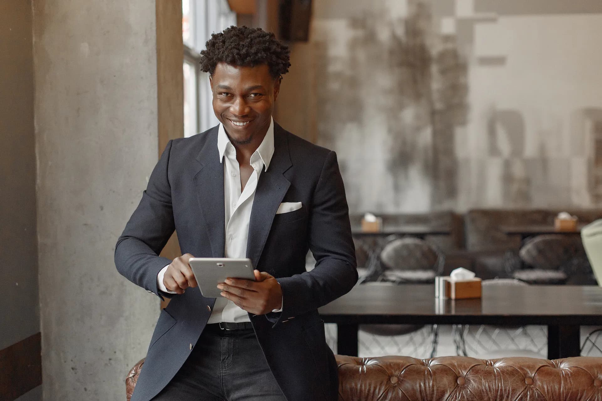 Business leader using a tablet in a professional setting